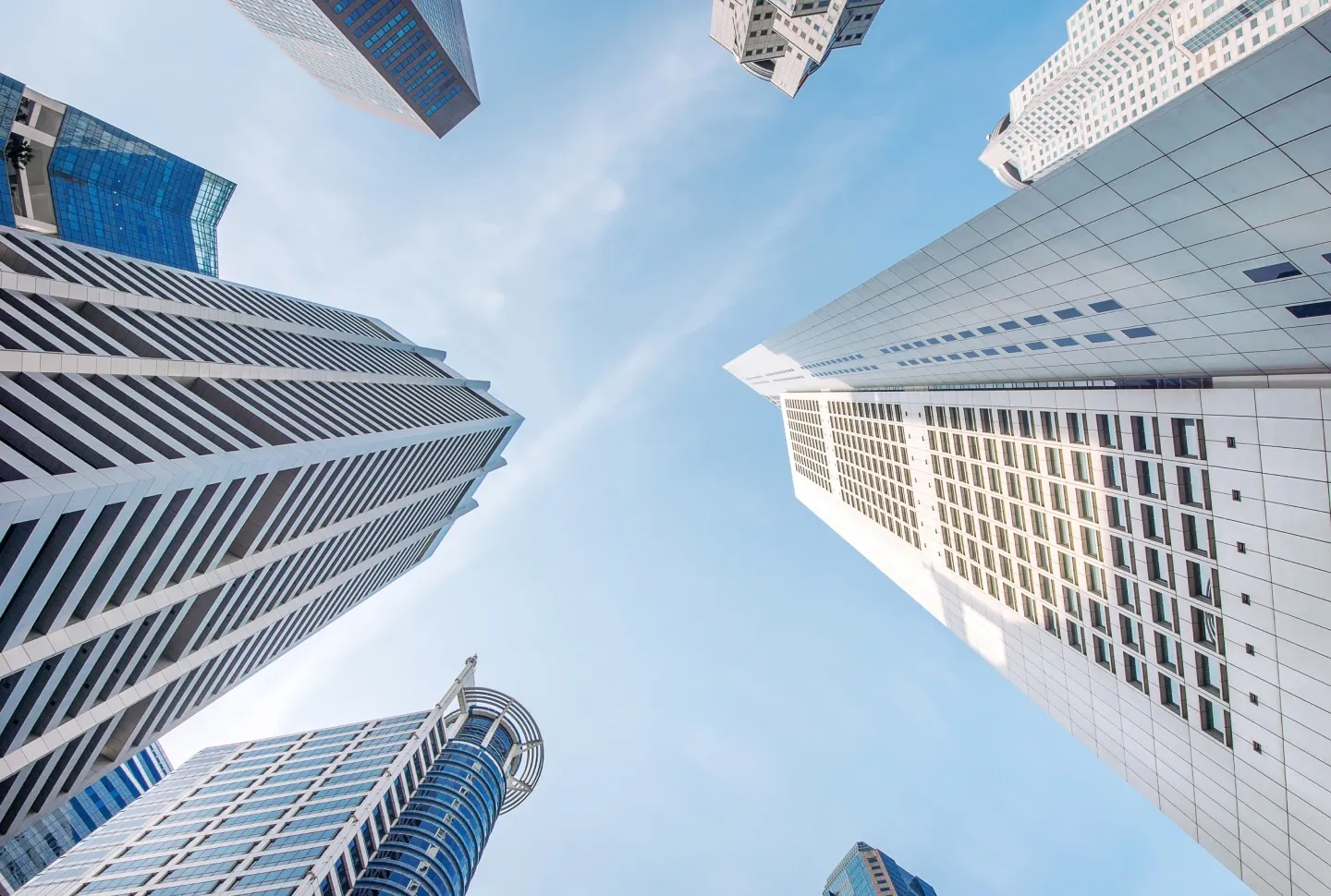 Skyscrapers symbolizing financial institutions and the role of AI in fintech, highlighting benefits and use cases in finance.